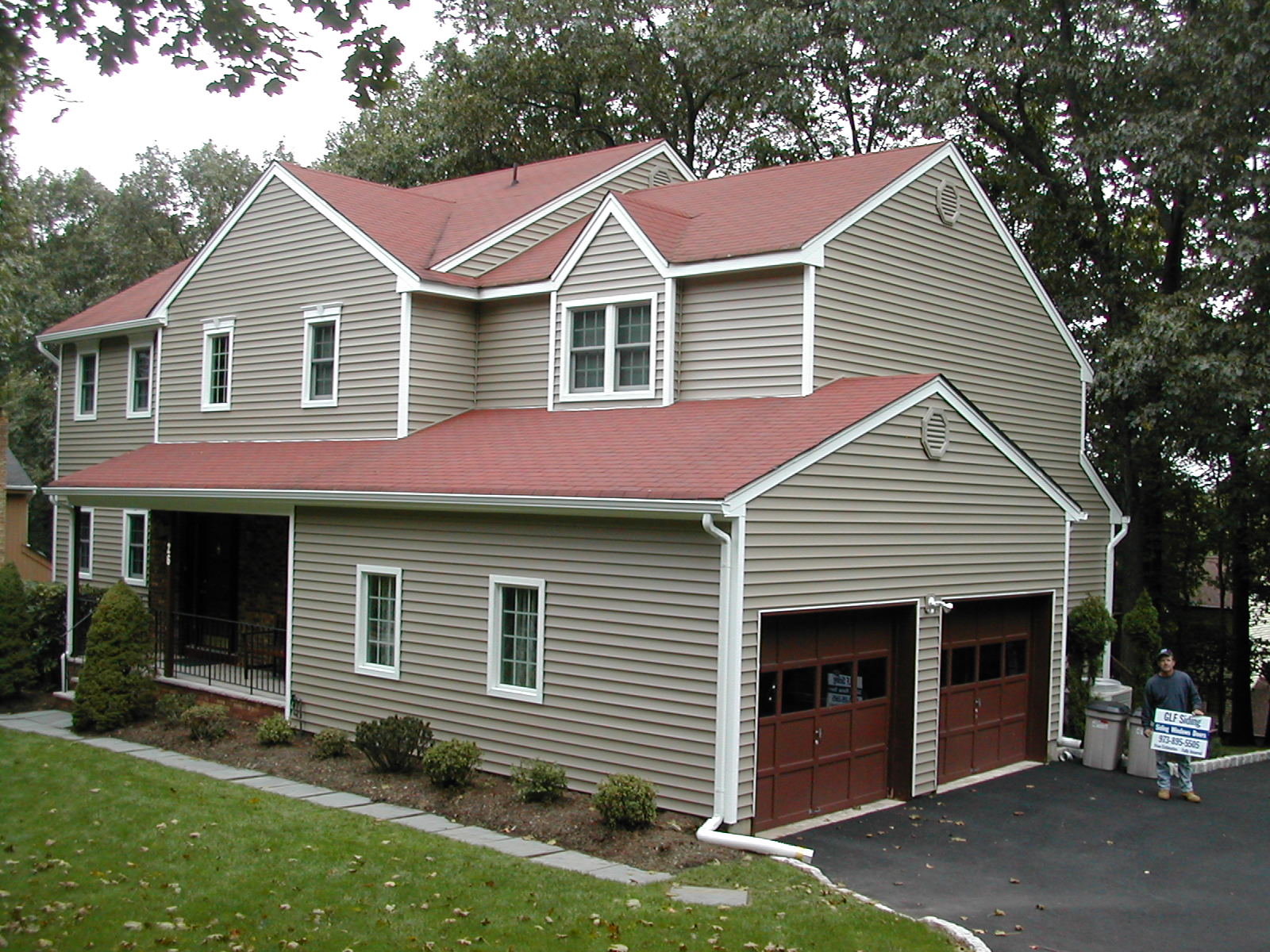 Contractor working on siding