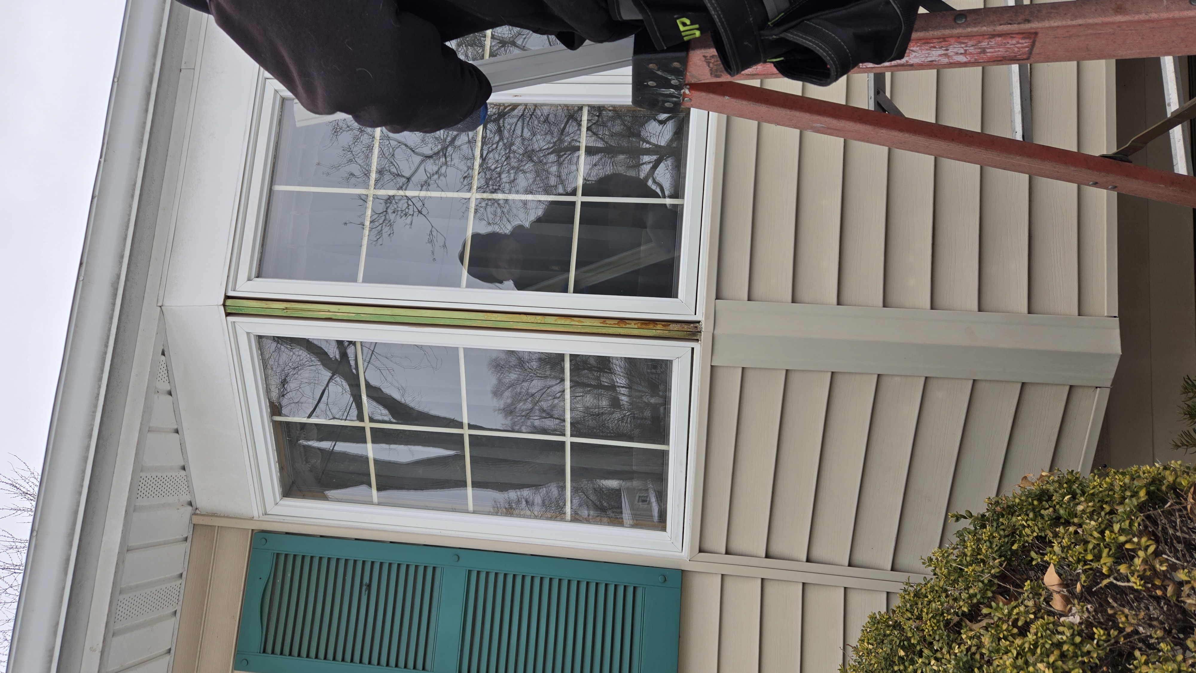 Loose exterior window trim before repair