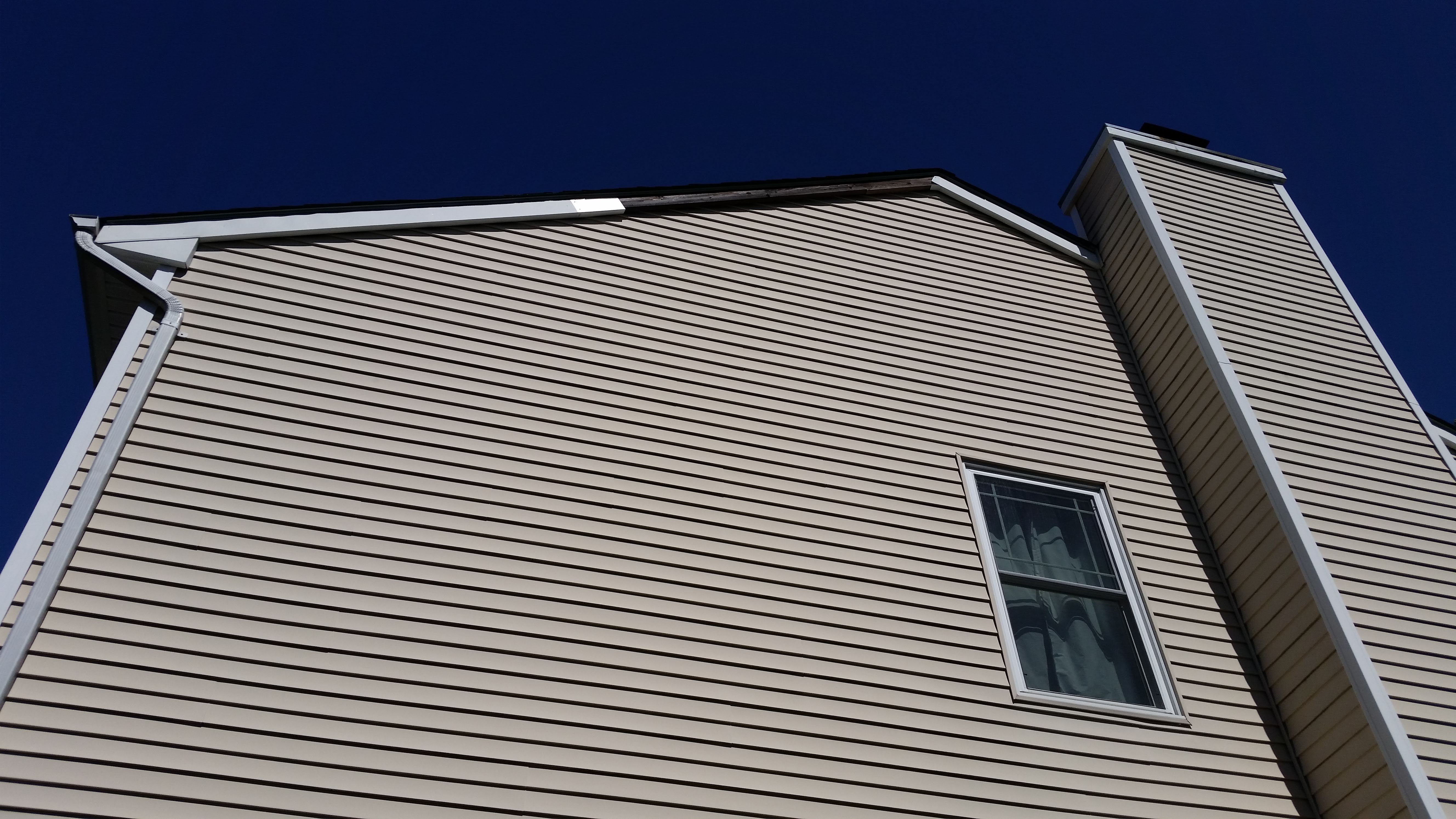 Example of damaged siding that we repair
